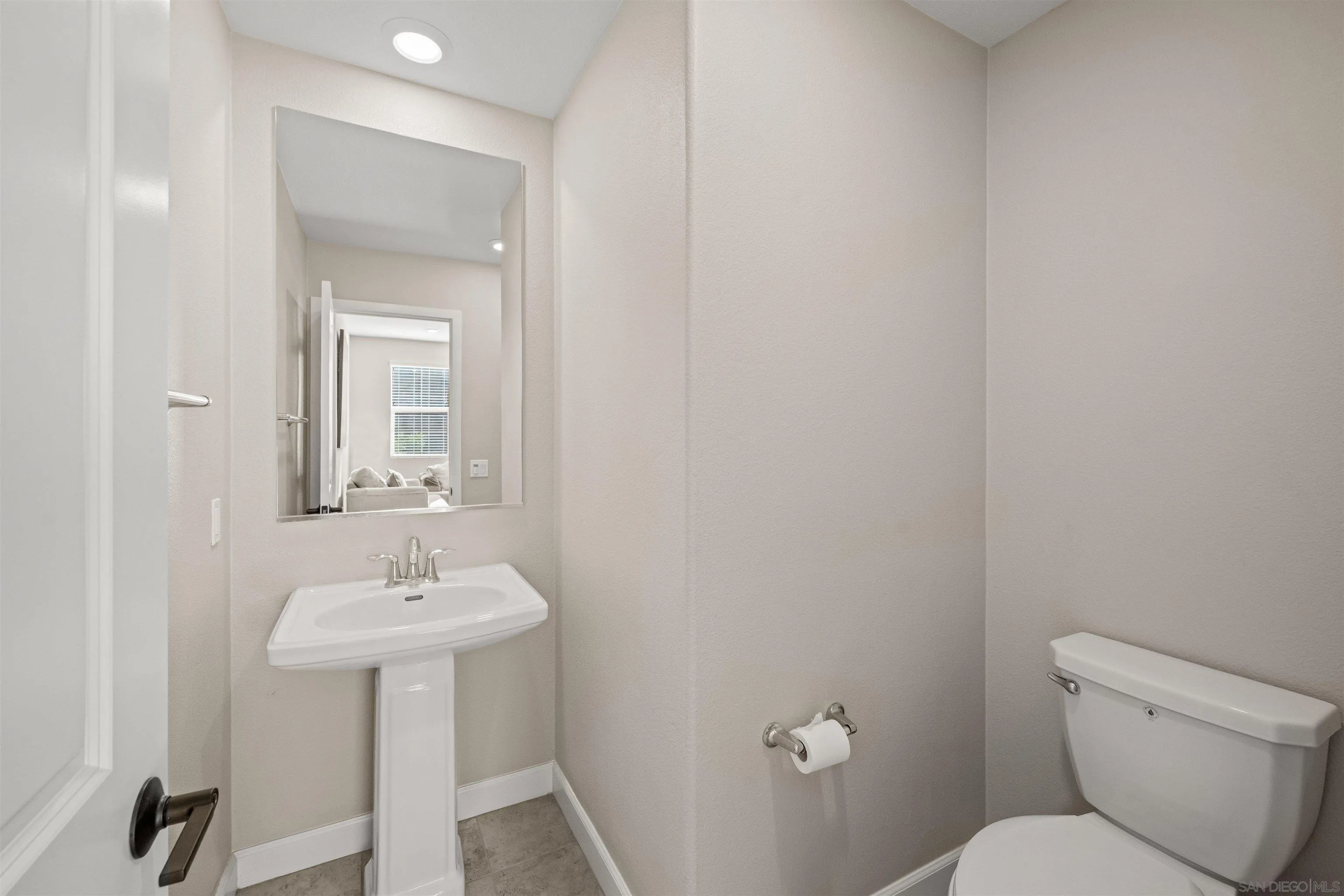 1151 Delpy View Point Vista, CA 92084 - Photo 14 of 44 a bathroom with a sink toilet and a mirror