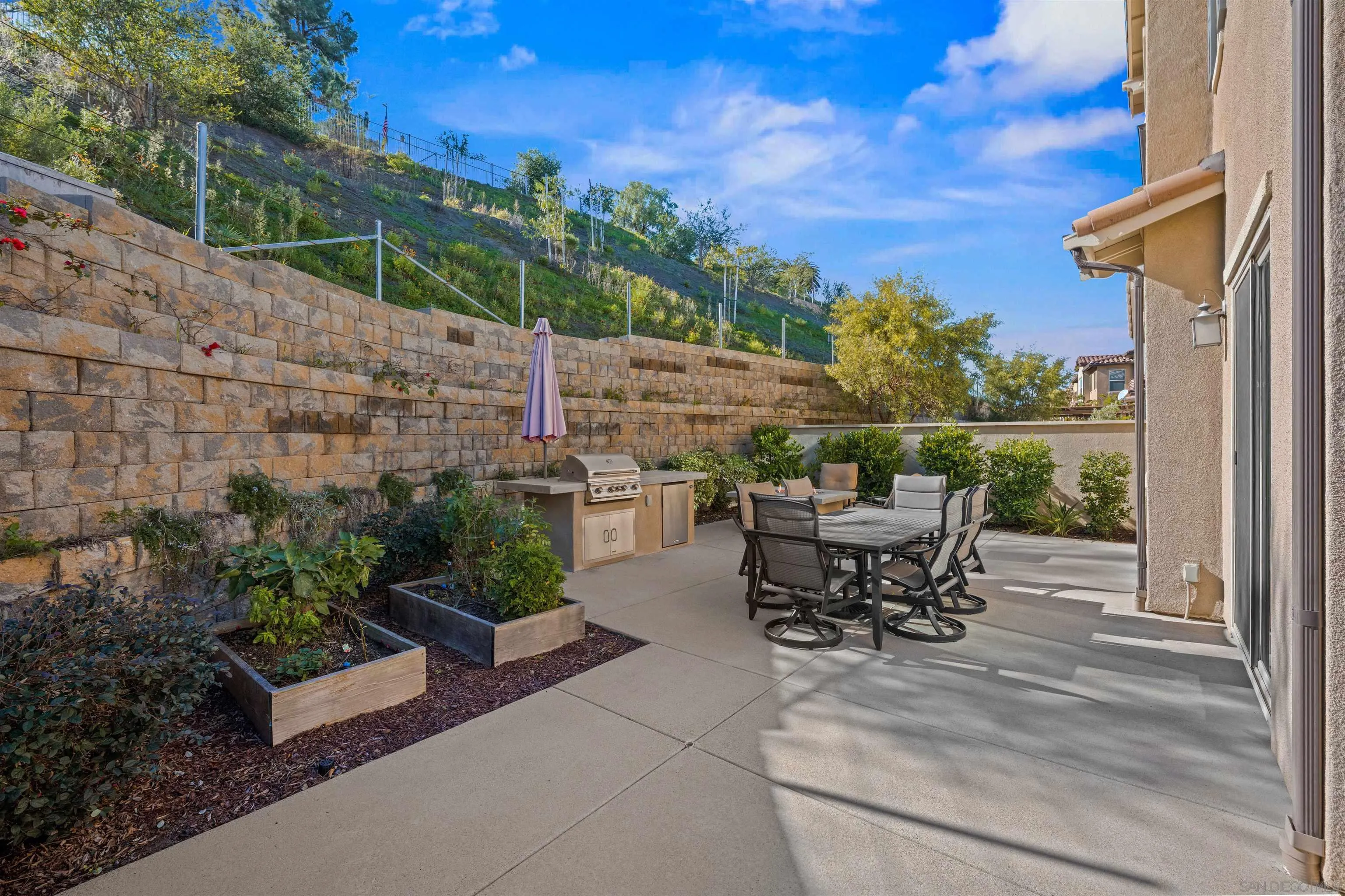 1151 Delpy View Point Vista, CA 92084 - Photo 30 of 44 a view of a patio with couches table and chairs and potted plants