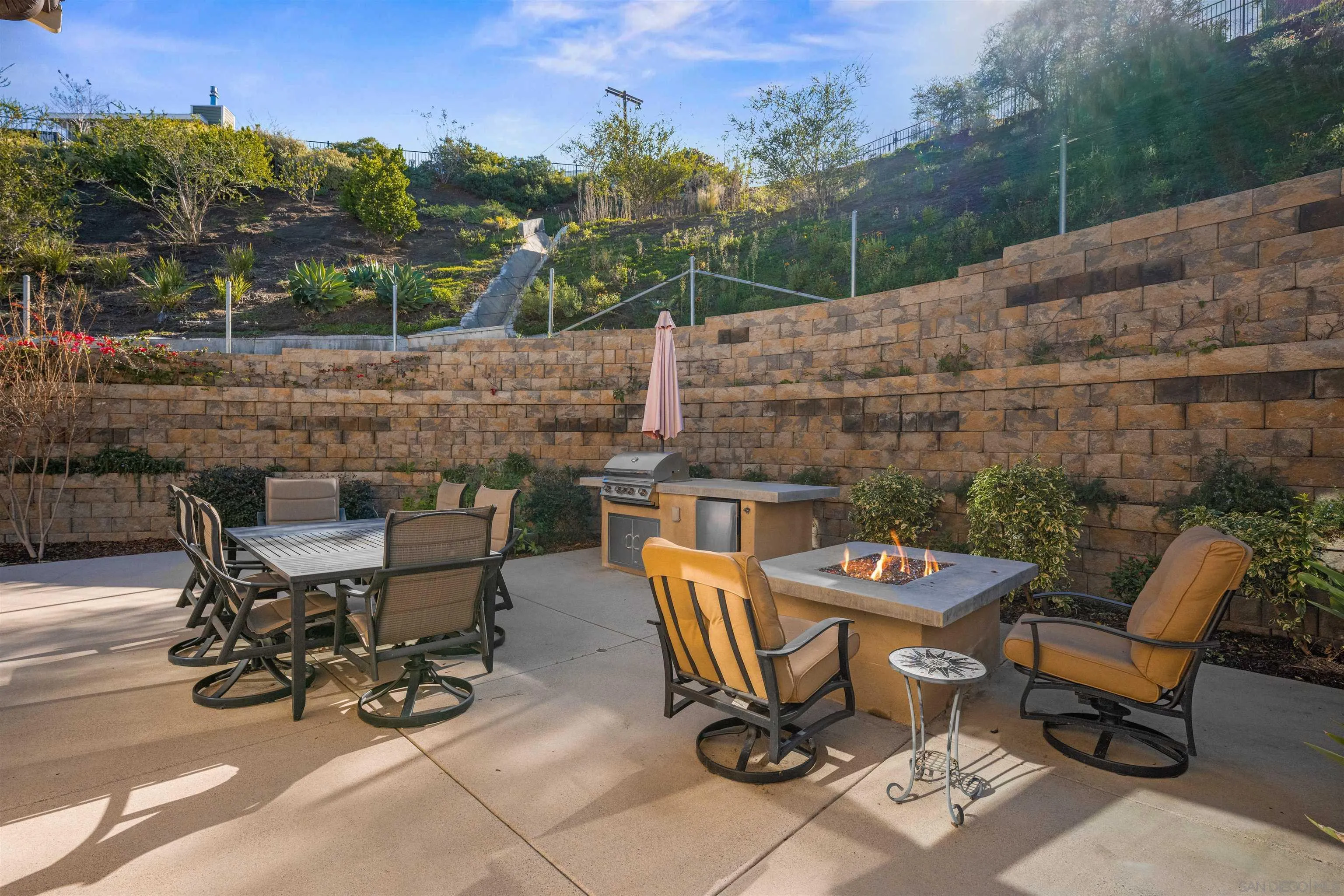 1151 Delpy View Point Vista, CA 92084 - Photo 31 of 44 a view of a patio with table and chairs and potted plants
