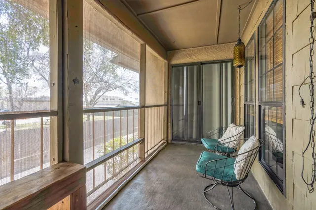 a view of front door with wooden floor
