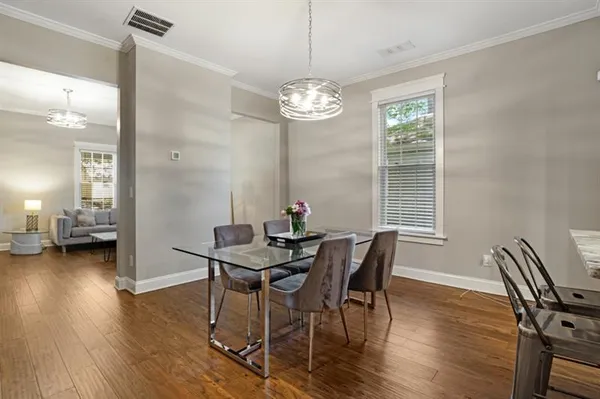 a view of a dining room with furniture window and wooden floor