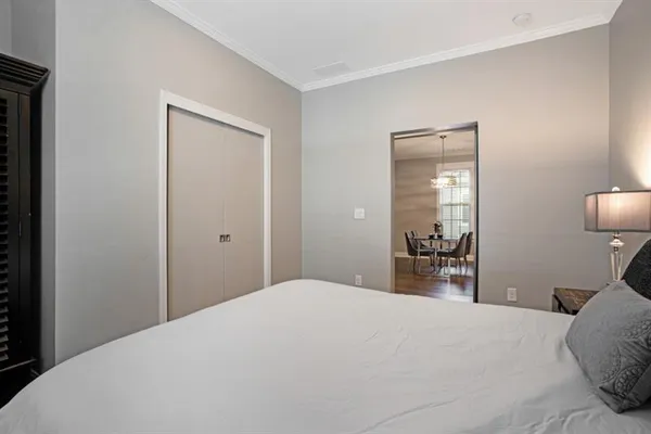 a bedroom with a bed and a mirror