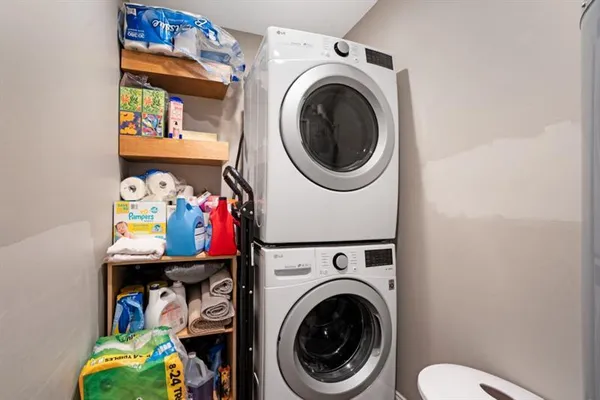 a view of a storage & utility room with dryer and washer