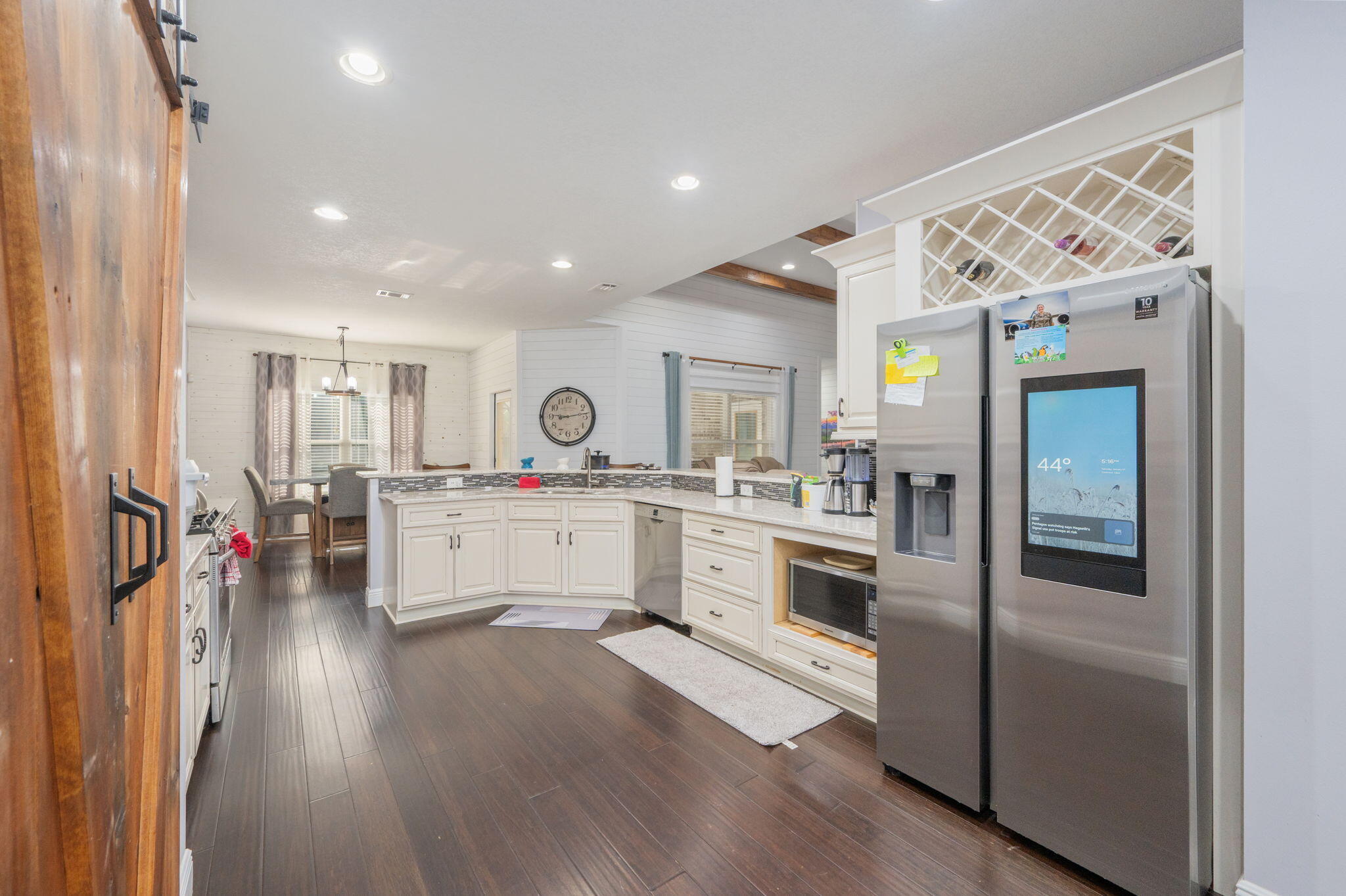 5777 Wildwood Road Crestview, FL 32536 - Photo 14 of 68 a kitchen with white cabinets and stainless steel appliances