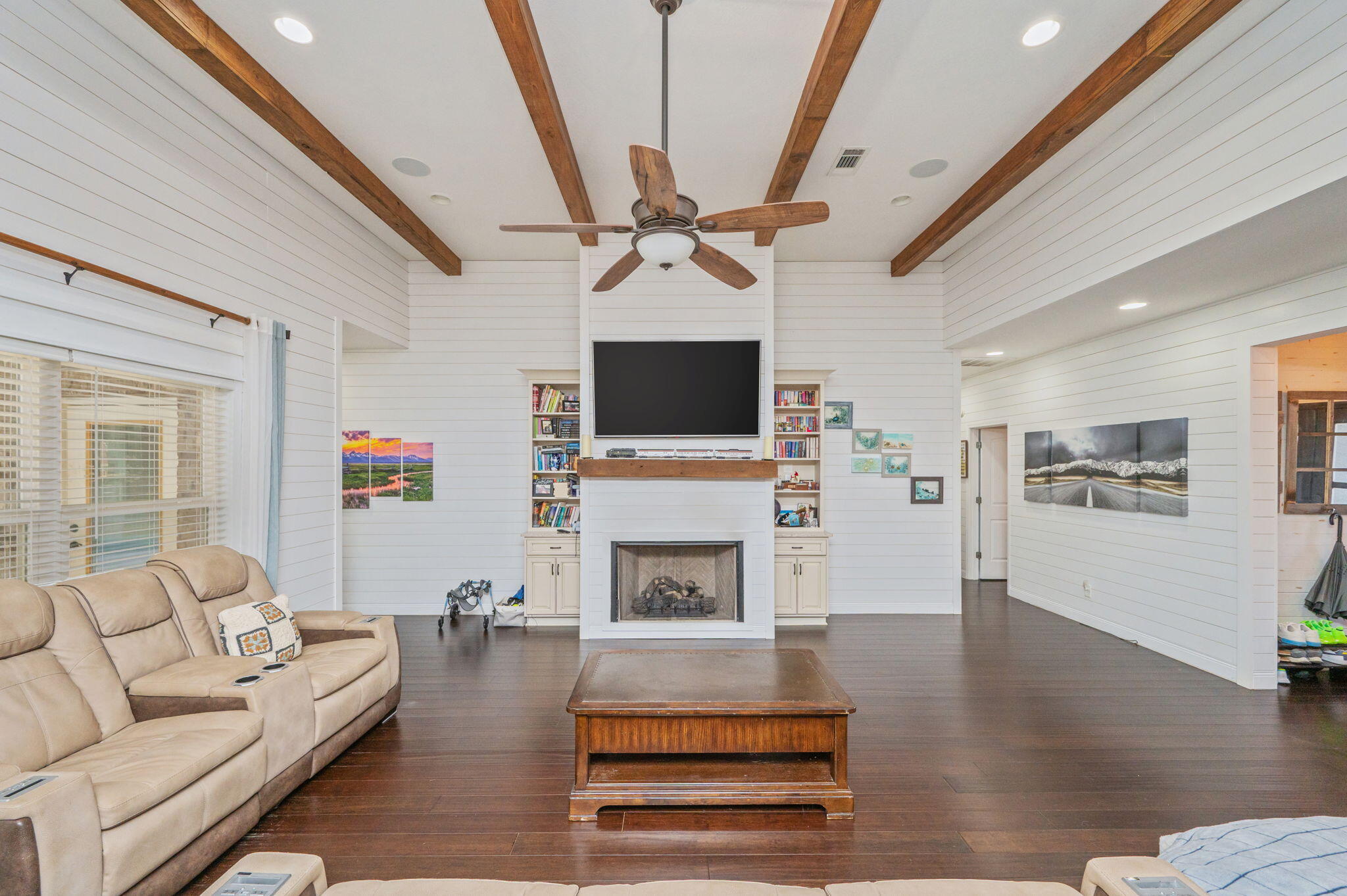 5777 Wildwood Road Crestview, FL 32536 - Photo 18 of 68 a living room with furniture a fireplace and a flat screen tv