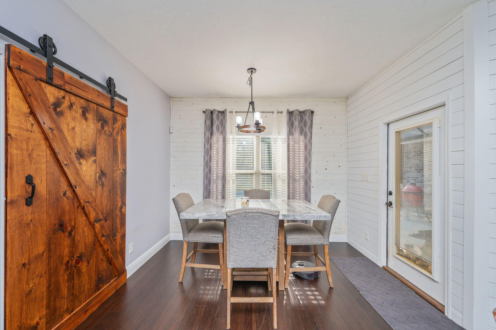 5777 Wildwood Road Crestview, FL 32536 - Photo 19 of 68 a view of a dining room with furniture window and wooden floor
