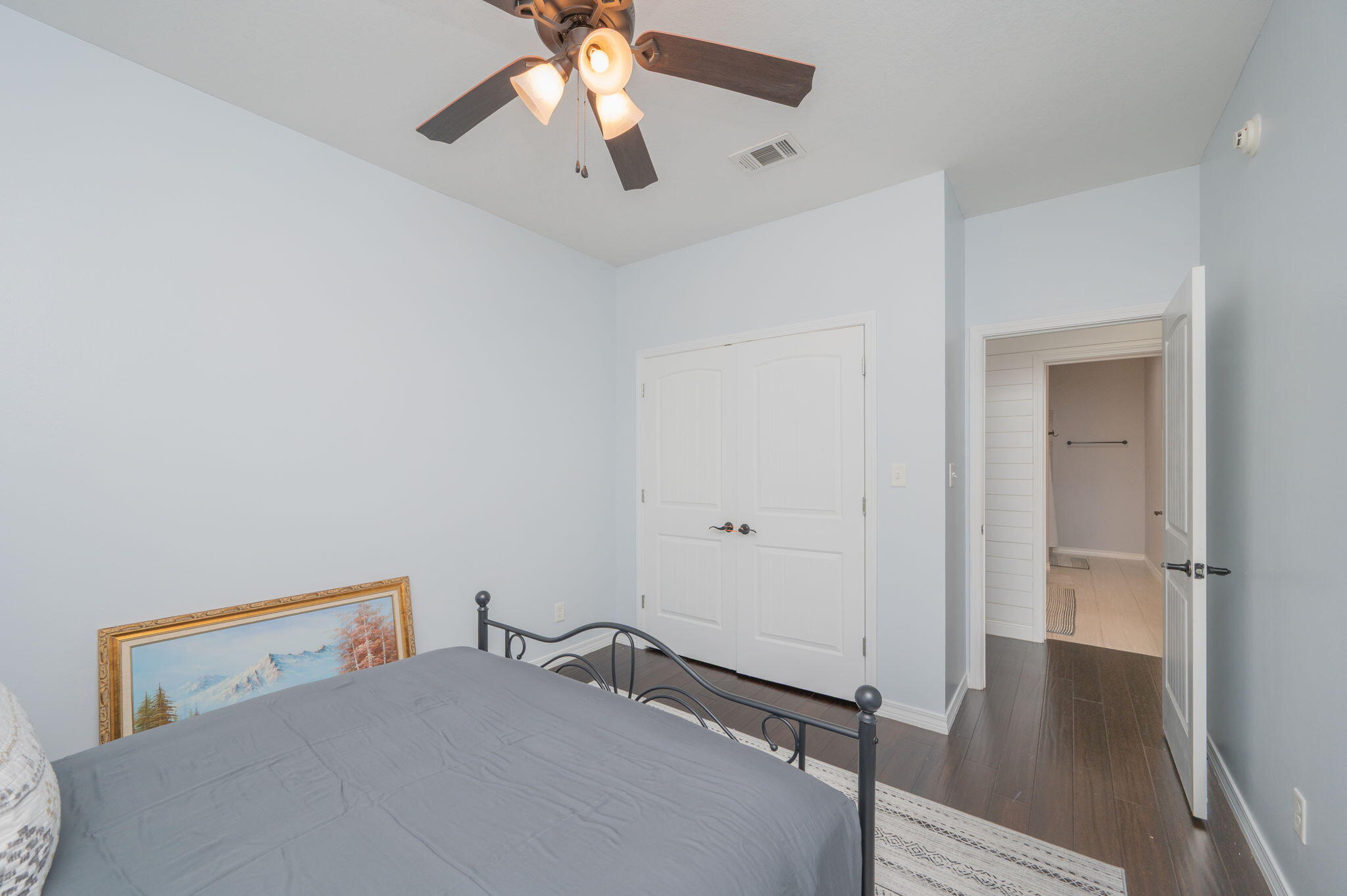 5777 Wildwood Road Crestview, FL 32536 - Photo 22 of 68 a bedroom with a bed and a chandelier fan