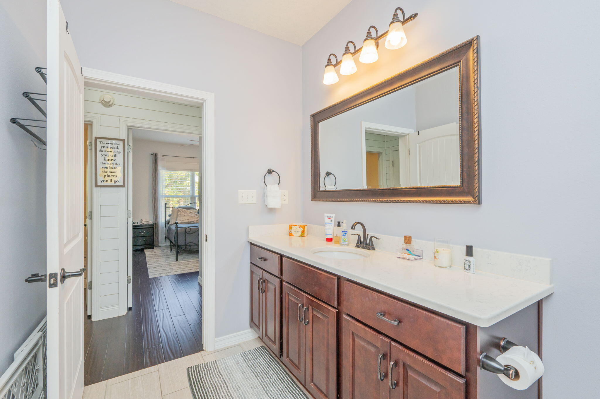 5777 Wildwood Road Crestview, FL 32536 - Photo 28 of 68 a bathroom with a sink vanity and a mirror