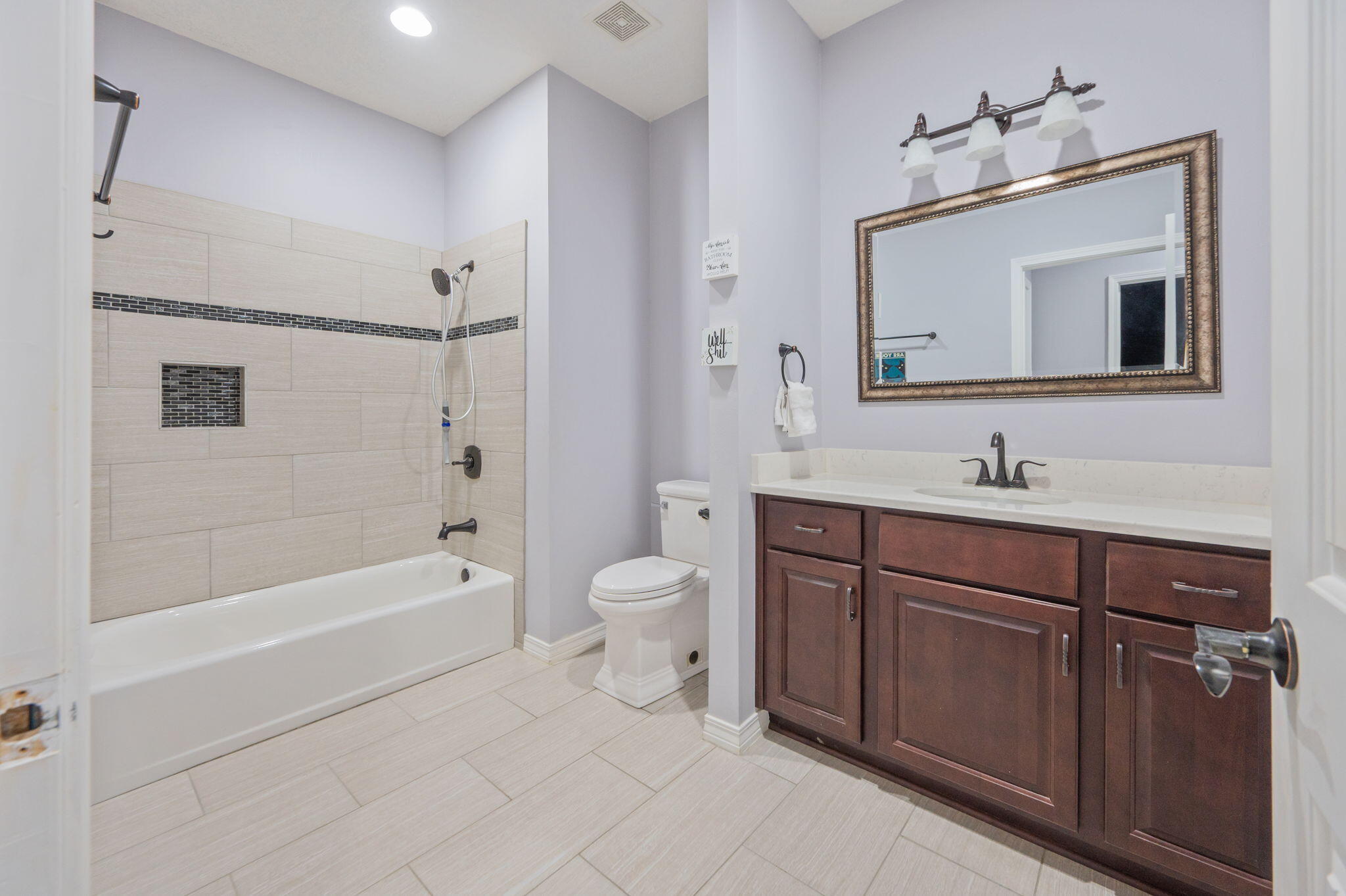 5777 Wildwood Road Crestview, FL 32536 - Photo 34 of 68 a bathroom with a sink a toilet and shower