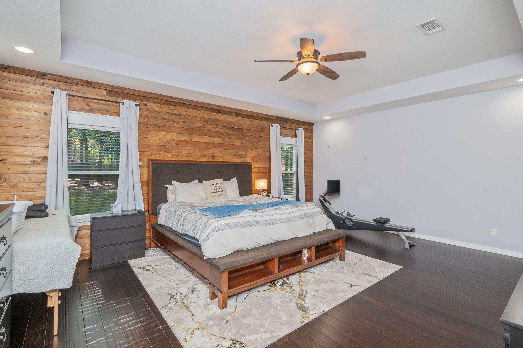 5777 Wildwood Road Crestview, FL 32536 - Photo 37 of 68 a bedroom with a bed and wooden floor