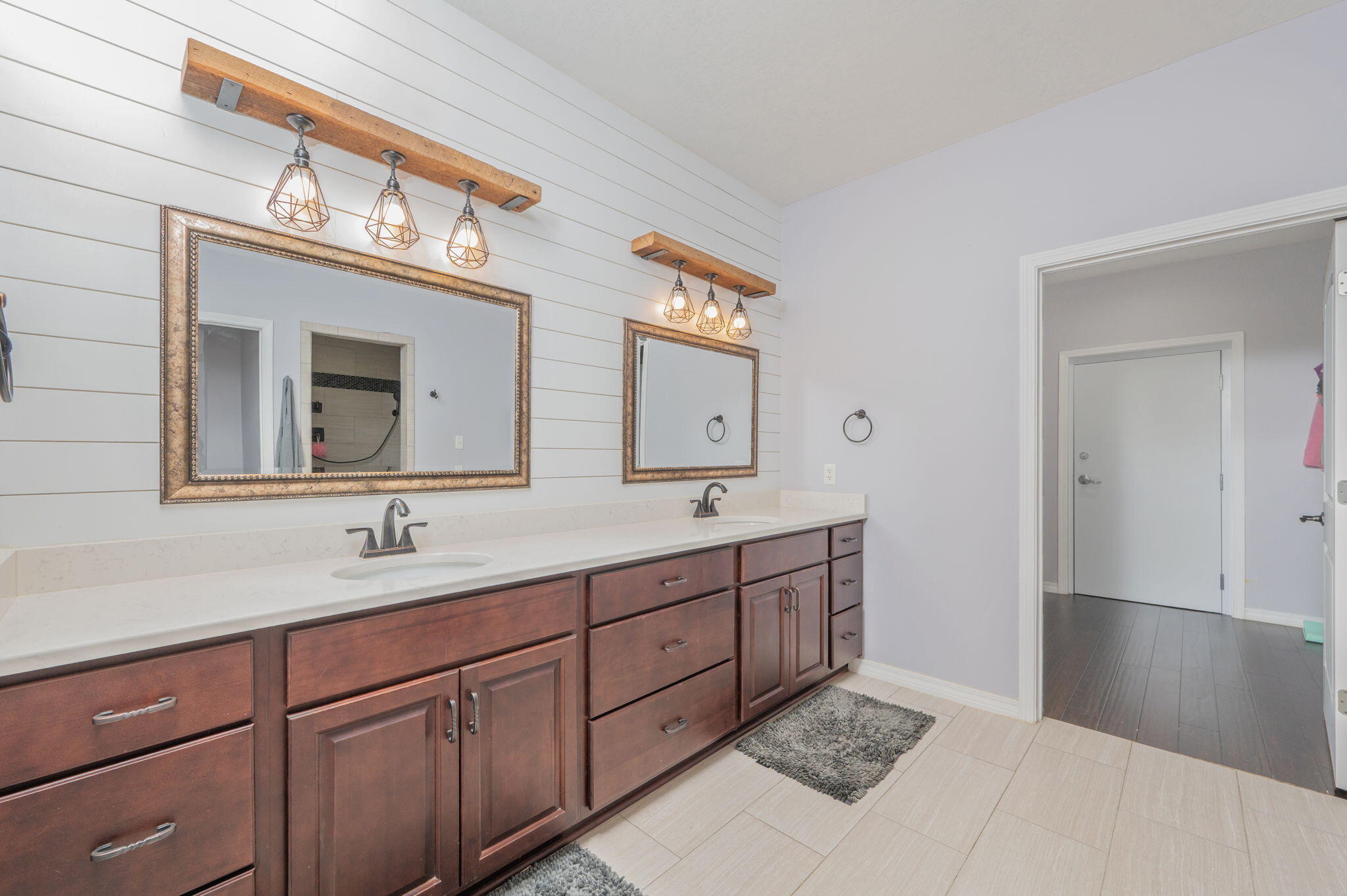5777 Wildwood Road Crestview, FL 32536 - Photo 40 of 68 a bathroom with a double vanity sink and a mirror