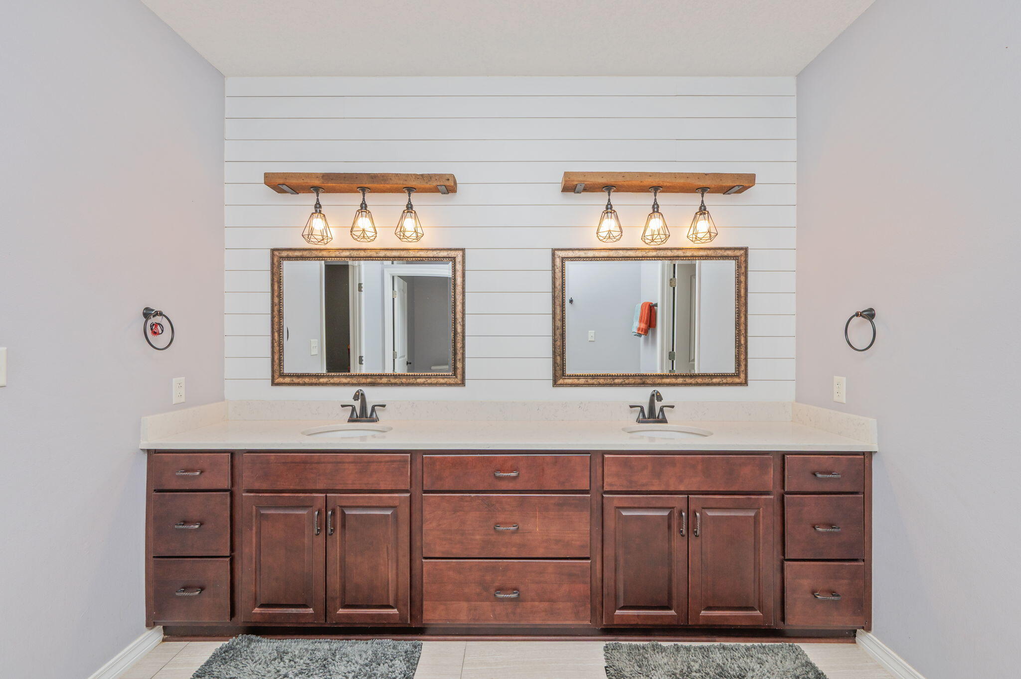 5777 Wildwood Road Crestview, FL 32536 - Photo 41 of 68 a bathroom with a double vanity sink and a mirror