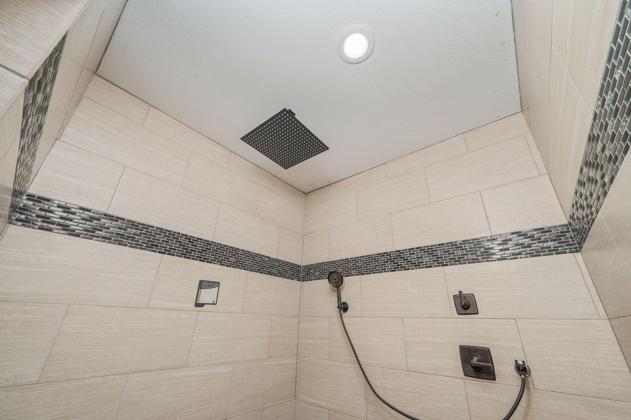 5777 Wildwood Road Crestview, FL 32536 - Photo 43 of 68 a bathroom with a shower and mirror