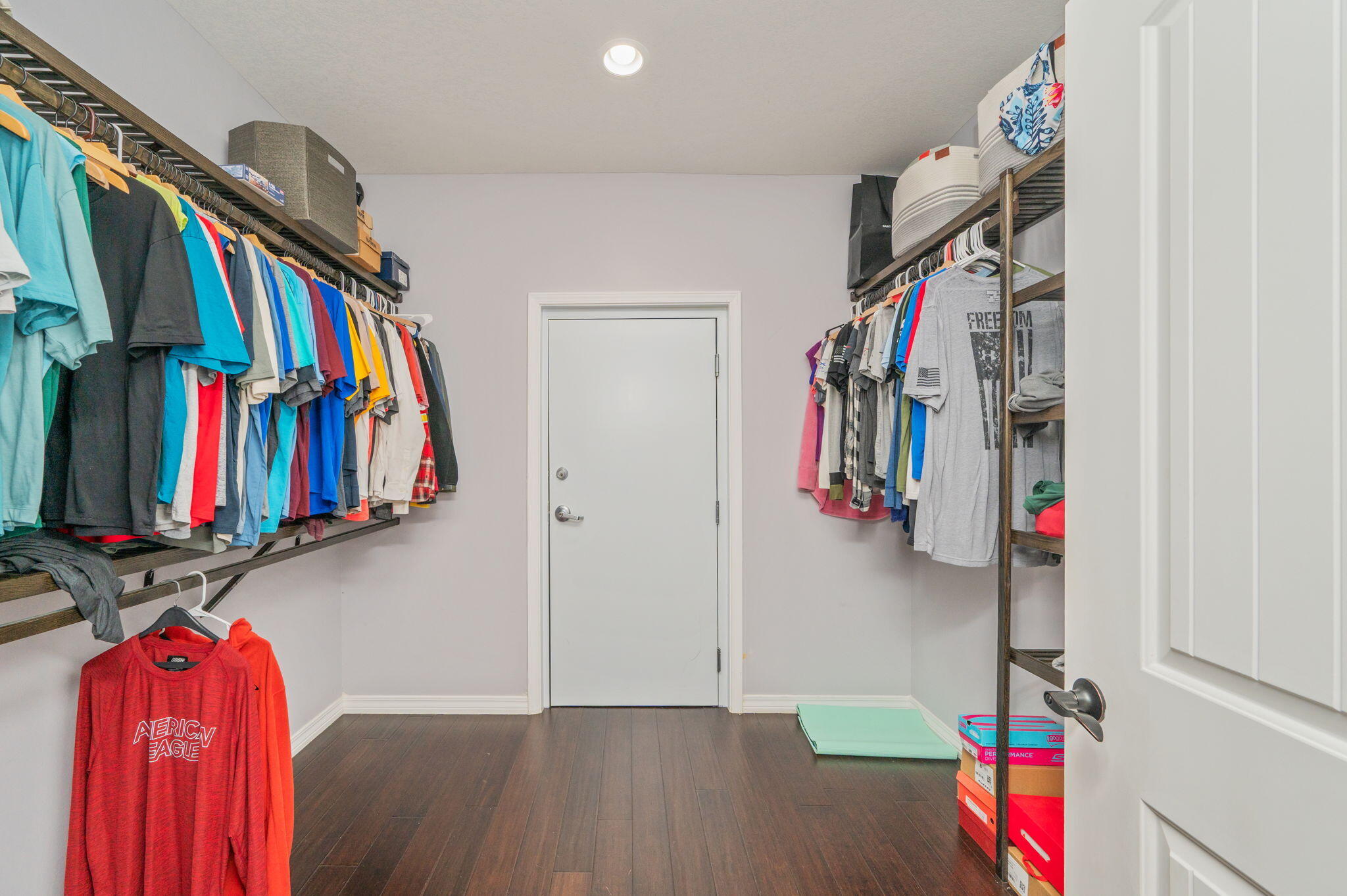 5777 Wildwood Road Crestview, FL 32536 - Photo 44 of 68 a view of walk in closet with clothes and shoes