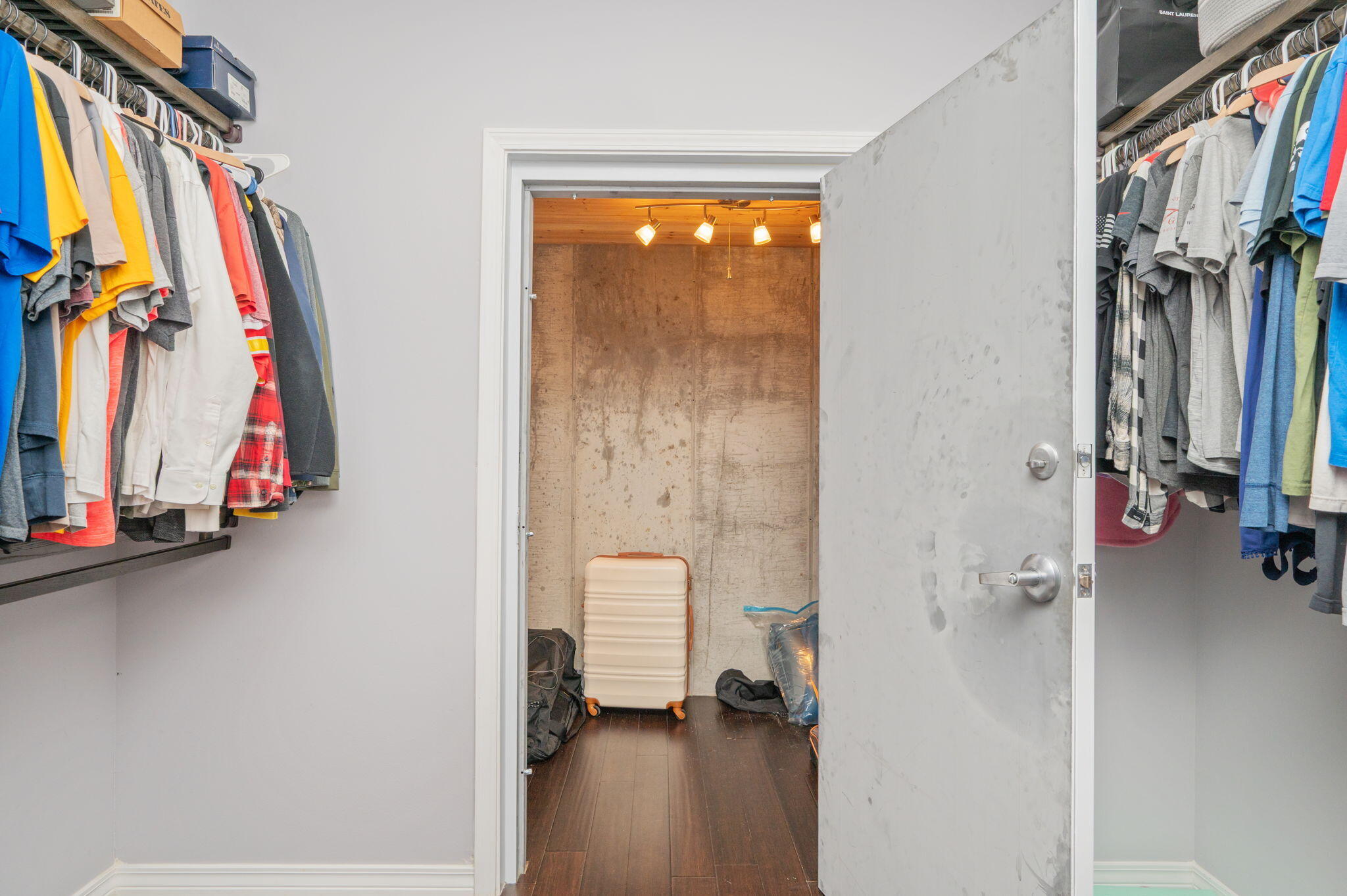 5777 Wildwood Road Crestview, FL 32536 - Photo 45 of 68 a view of walk in closet with clothes and shoes