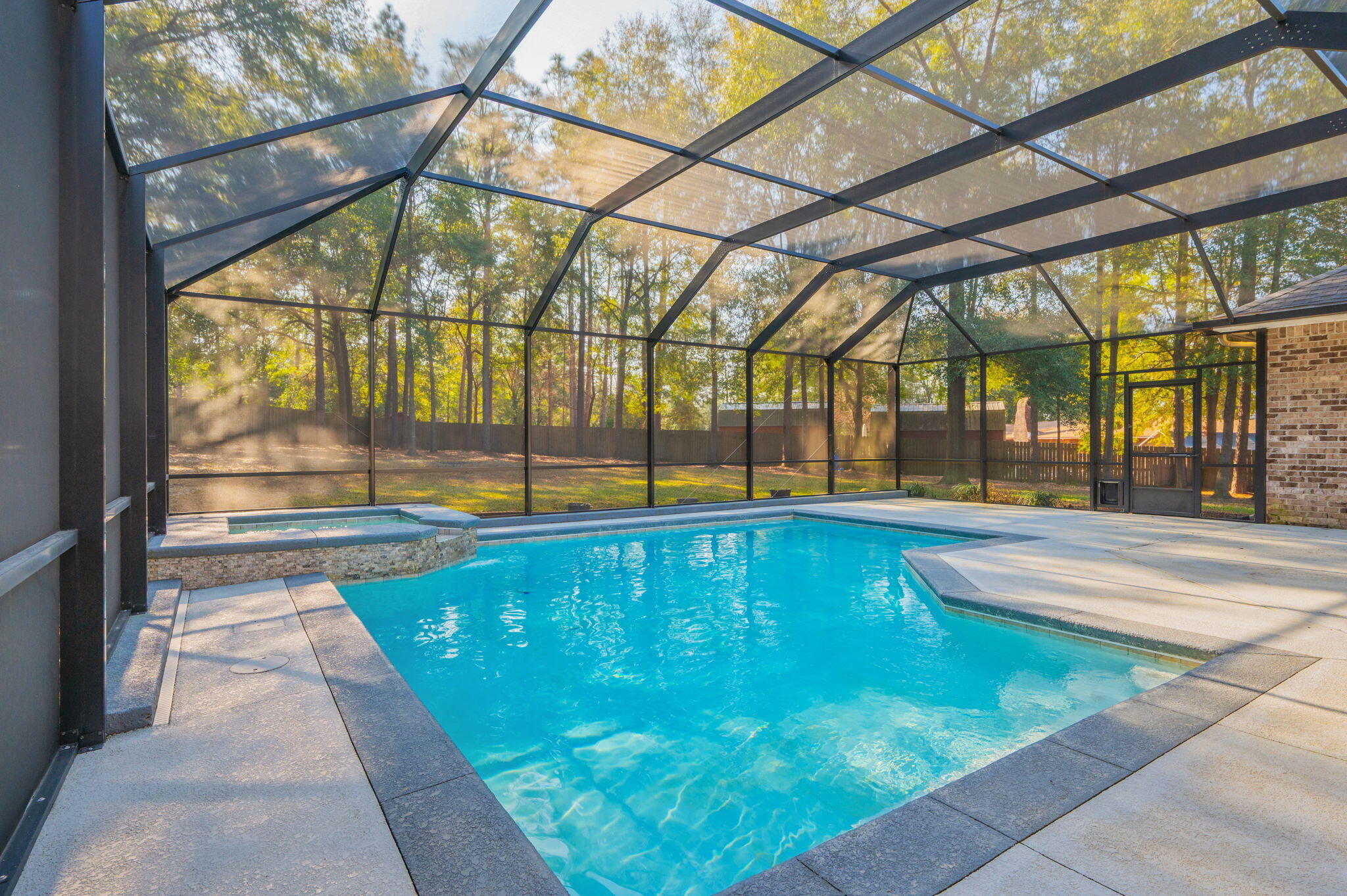 5777 Wildwood Road Crestview, FL 32536 - Photo 52 of 68 a swimming pool with outdoor seating
