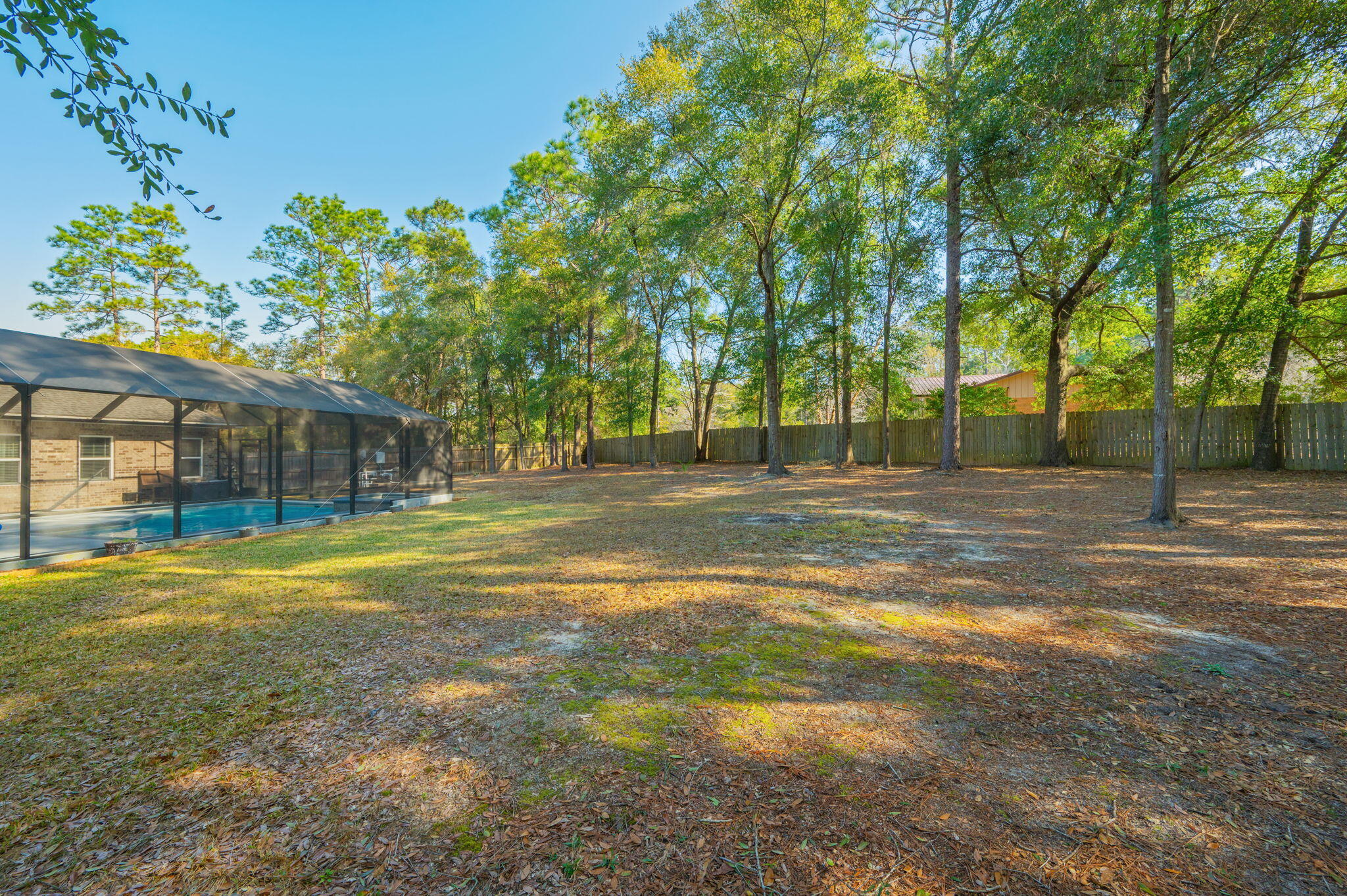 5777 Wildwood Road Crestview, FL 32536 - Photo 57 of 68 a house view with swimming pool in front of it