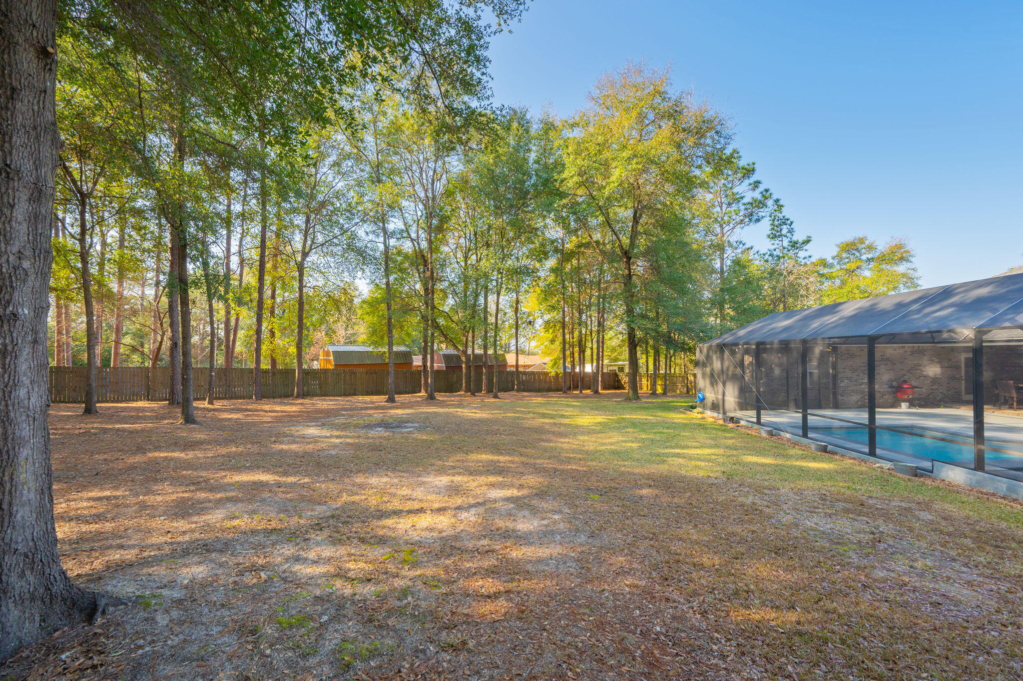 5777 Wildwood Road Crestview, FL 32536 - Photo 60 of 68 a view of a trees in front of a house