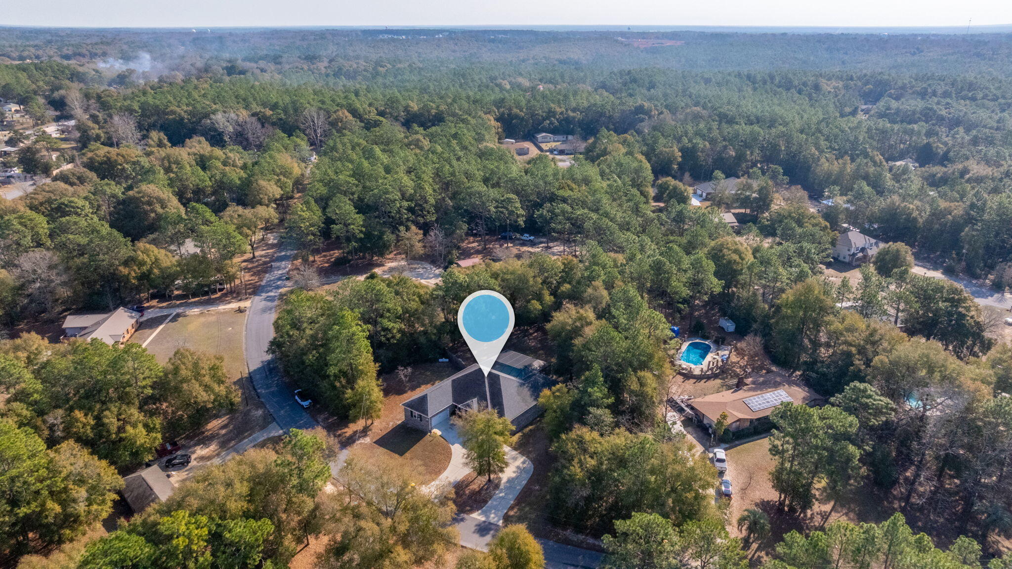 5777 Wildwood Road Crestview, FL 32536 - Photo 63 of 68 an aerial view of a house with a yard and lake view