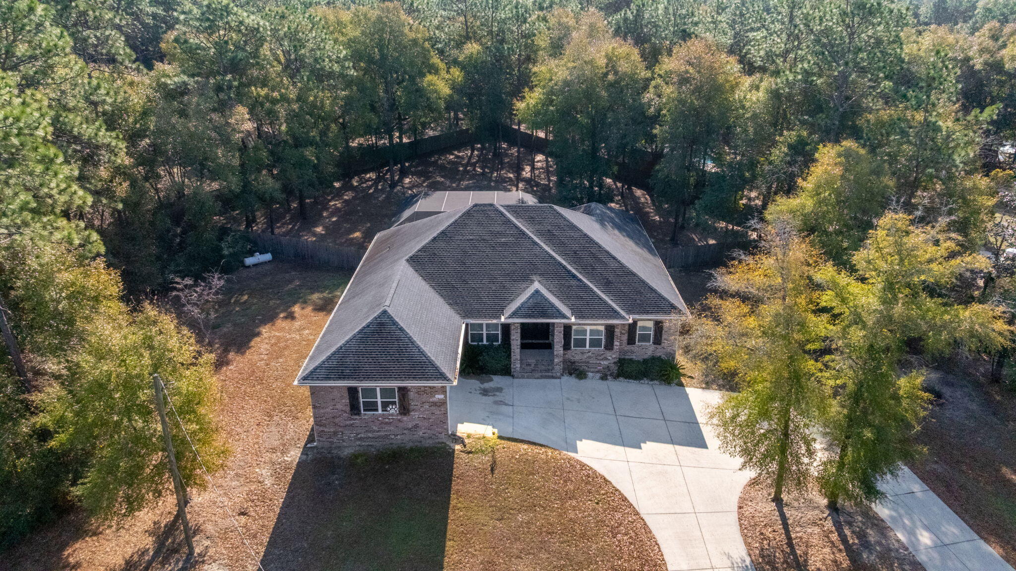 5777 Wildwood Road Crestview, FL 32536 - Photo 67 of 68 an aerial view of a house with a yard
