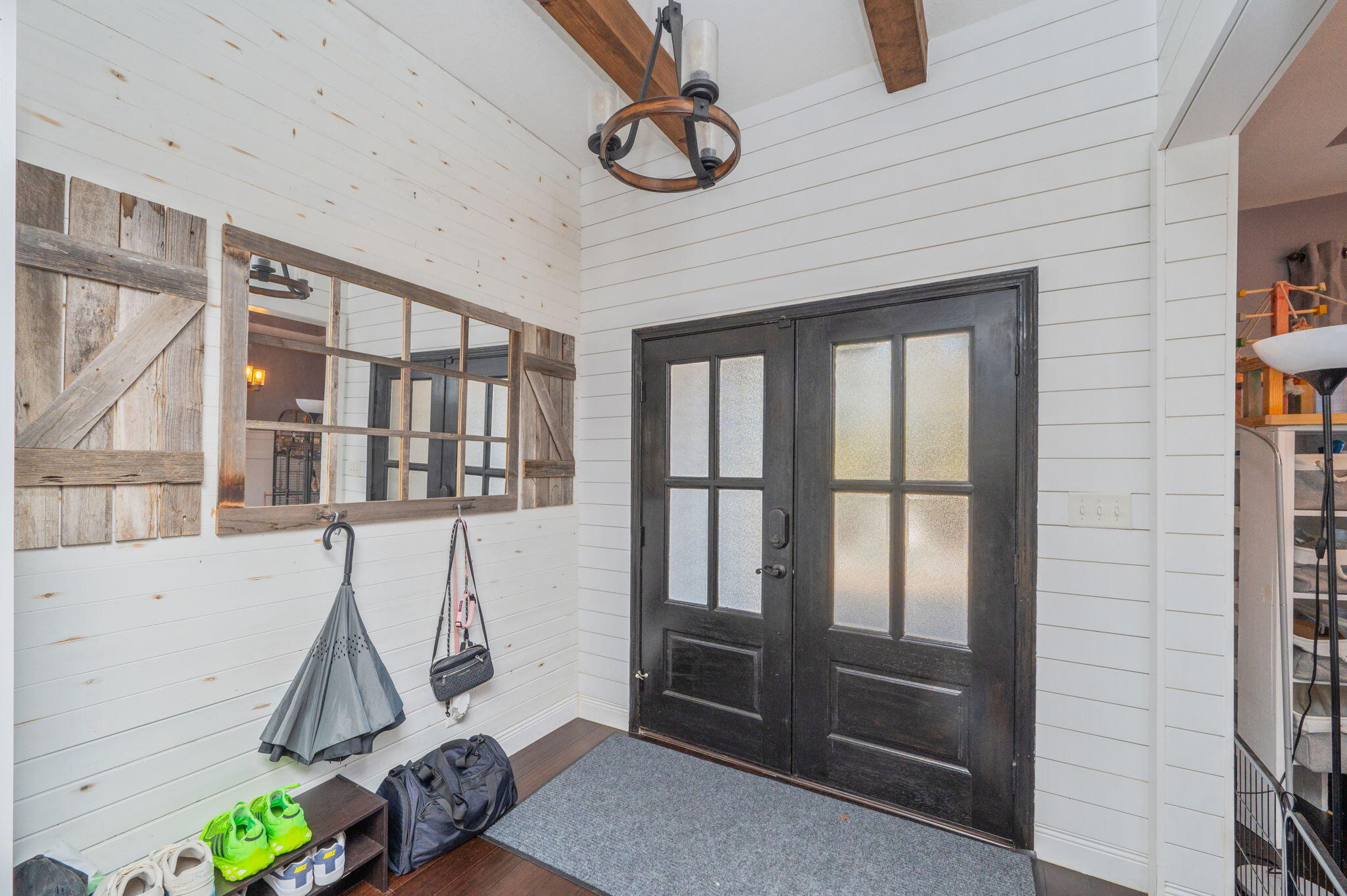 5777 Wildwood Road Crestview, FL 32536 - Photo 8 of 68 a view of an entryway with wooden floor and door