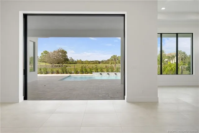a white bath tub sitting next to a small bathroom