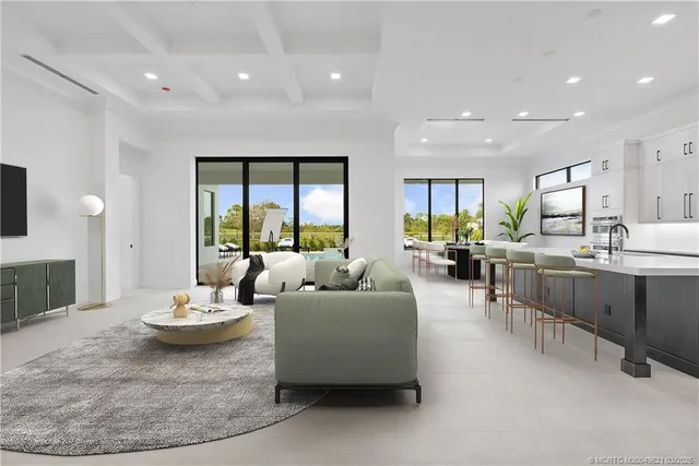 a kitchen with stainless steel appliances granite countertop white cabinets and sink