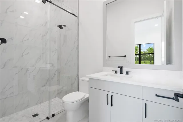 a view of a house with a garden and pathway