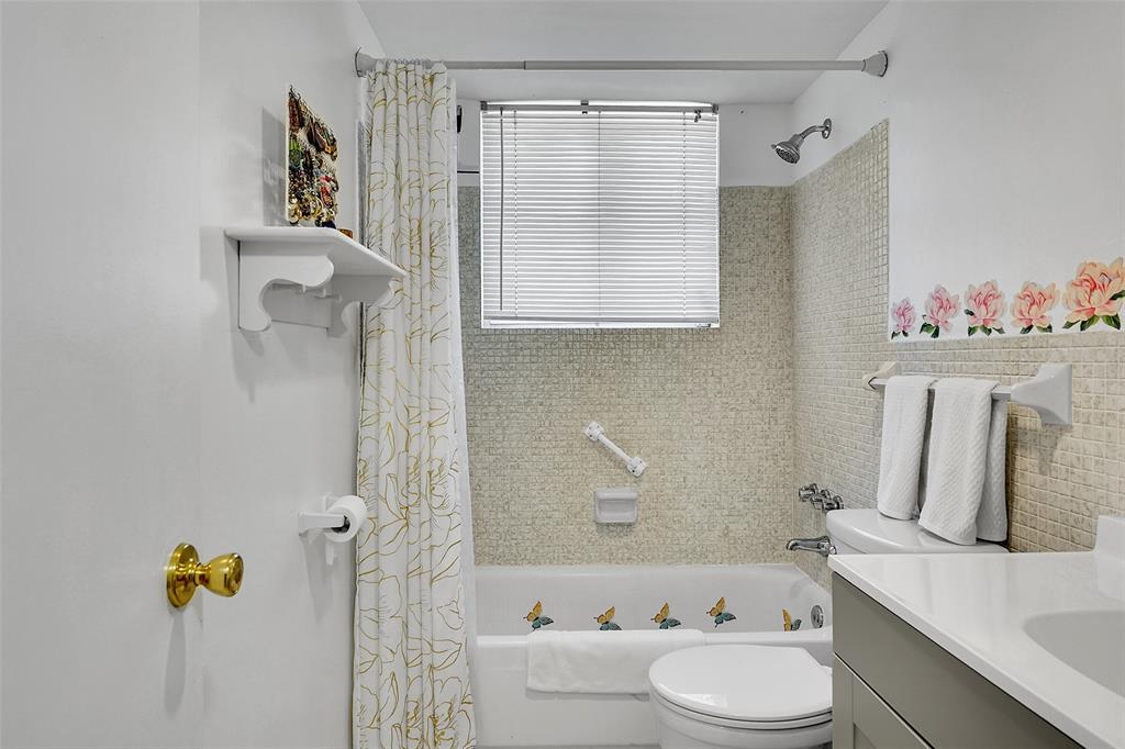 330 South Cypress Road, Unit 610 Pompano Beach, FL 33060 - Photo 11 of 35 a bathroom with a sink toilet and mirror