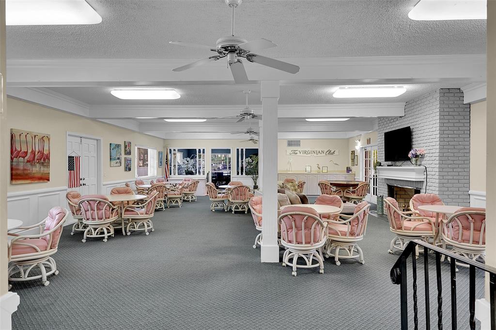 330 South Cypress Road, Unit 610 Pompano Beach, FL 33060 - Photo 25 of 35 a living room with furniture and a flat screen tv