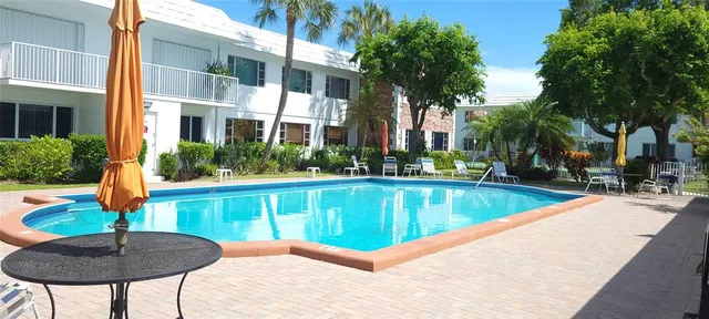 a view of a swimming pool with a lounge chair
