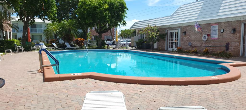 330 South Cypress Road, Unit 610 Pompano Beach, FL 33060 - Photo 28 of 35 a view of a swimming pool with a patio