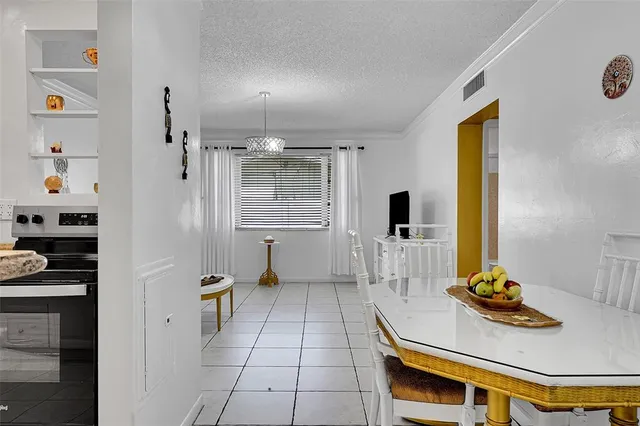 a kitchen with stainless steel appliances a refrigerator and a stove top oven