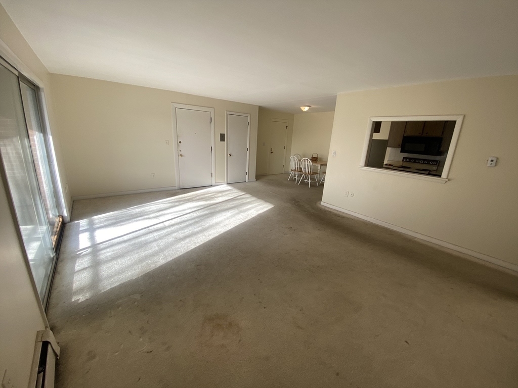 64 Jacqueline Road, Unit 11 Waltham, MA 02452 - Photo 12 of 17 a view of livingroom with hardwood floor
