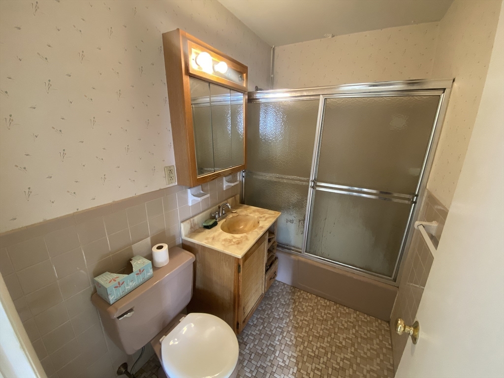 64 Jacqueline Road, Unit 11 Waltham, MA 02452 - Photo 17 of 17 a bathroom with a toilet and a shower