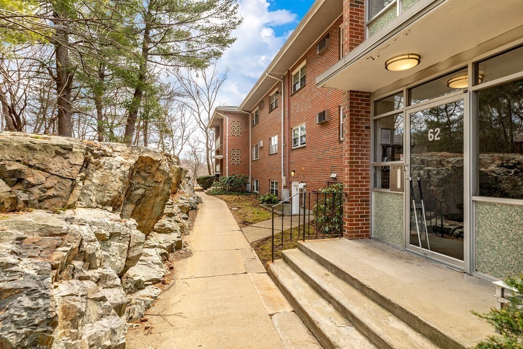 64 Jacqueline Road, Unit 11 Waltham, MA 02452 - Photo 3 of 17 a view of a pathway with a house