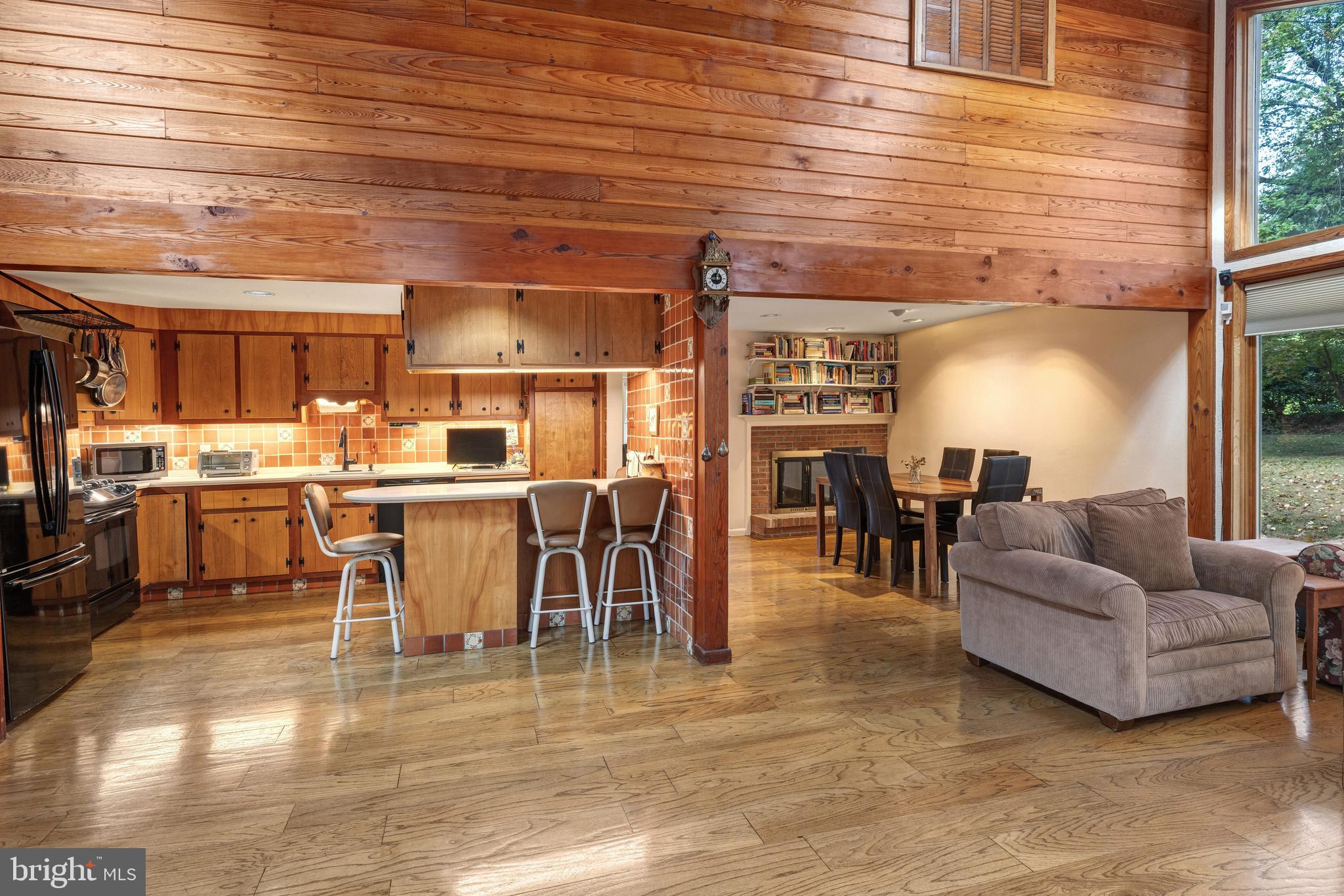 2390 Terwood Road Huntingdon Valley, PA 19006 - Photo 12 of 36 a living room with lots of furniture and a kitchen view