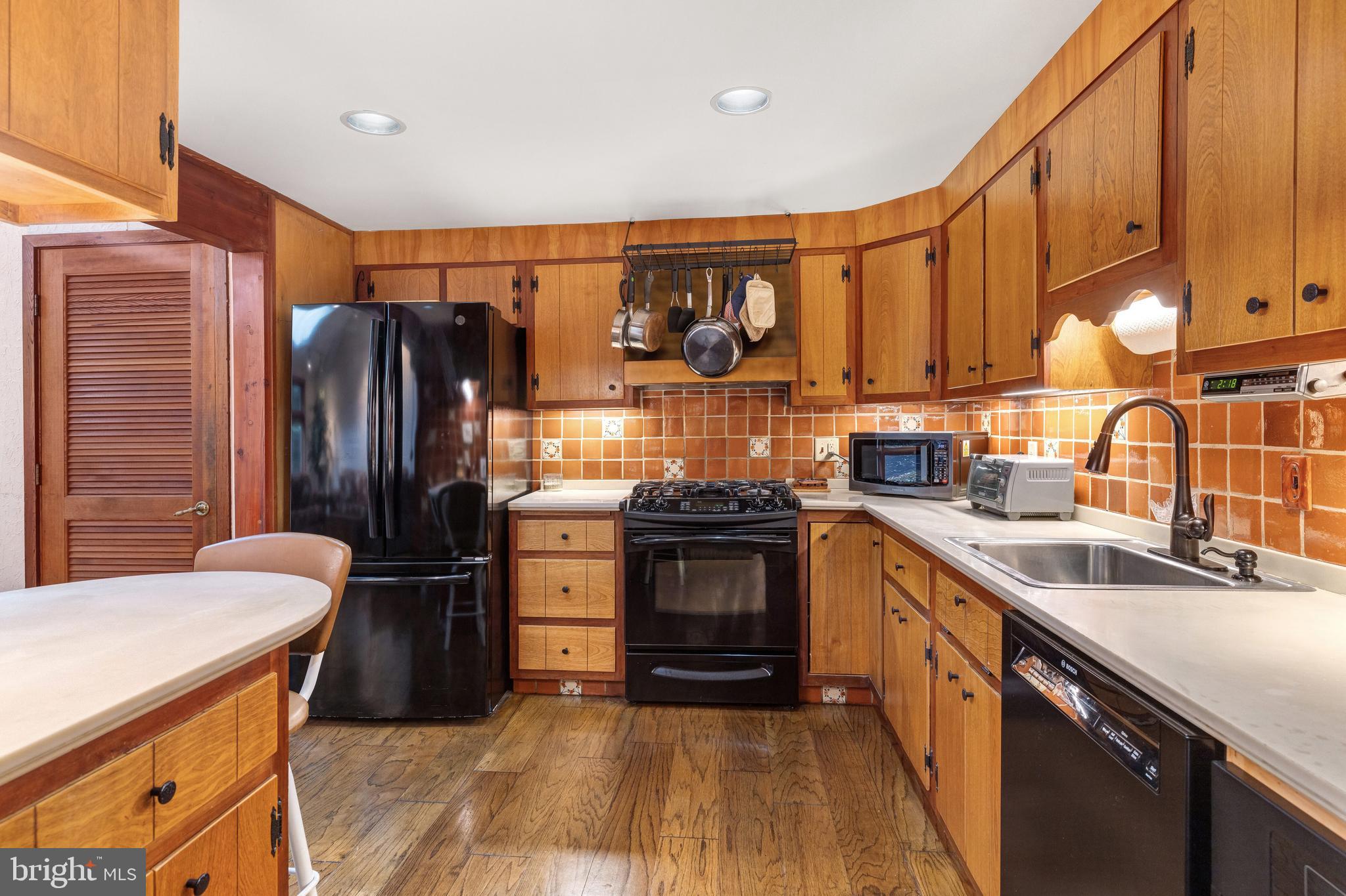 2390 Terwood Road Huntingdon Valley, PA 19006 - Photo 14 of 36 a kitchen with stainless steel appliances granite countertop a refrigerator sink and stove