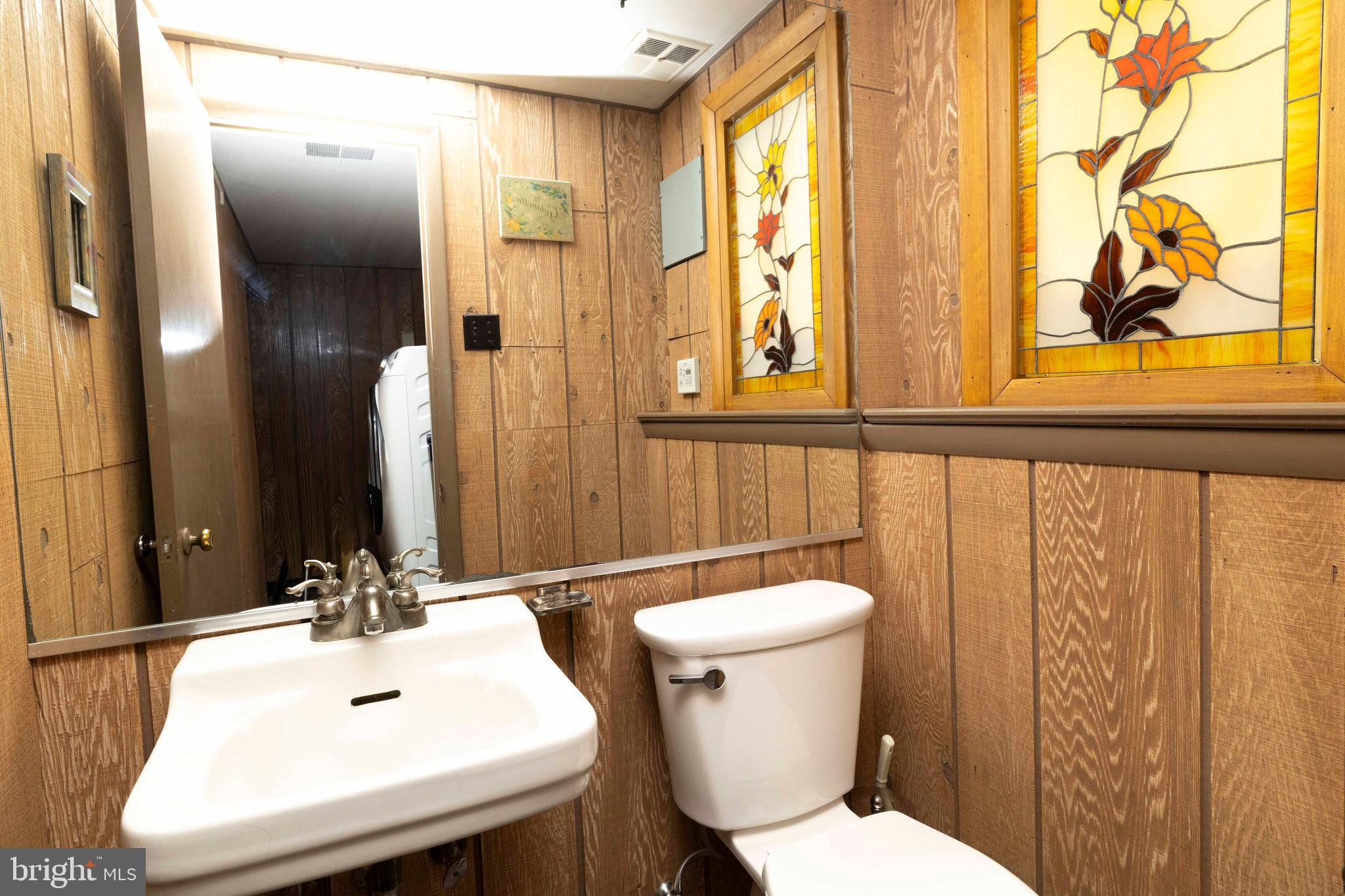 2390 Terwood Road Huntingdon Valley, PA 19006 - Photo 18 of 36 a bathroom with a sink a toilet and a mirror