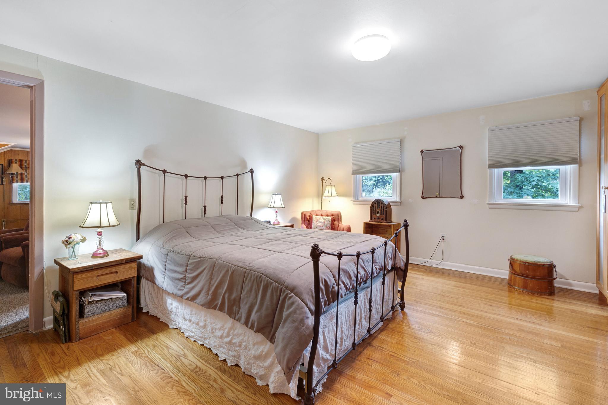 2390 Terwood Road Huntingdon Valley, PA 19006 - Photo 19 of 36 a bedroom with a bed and wooden floor