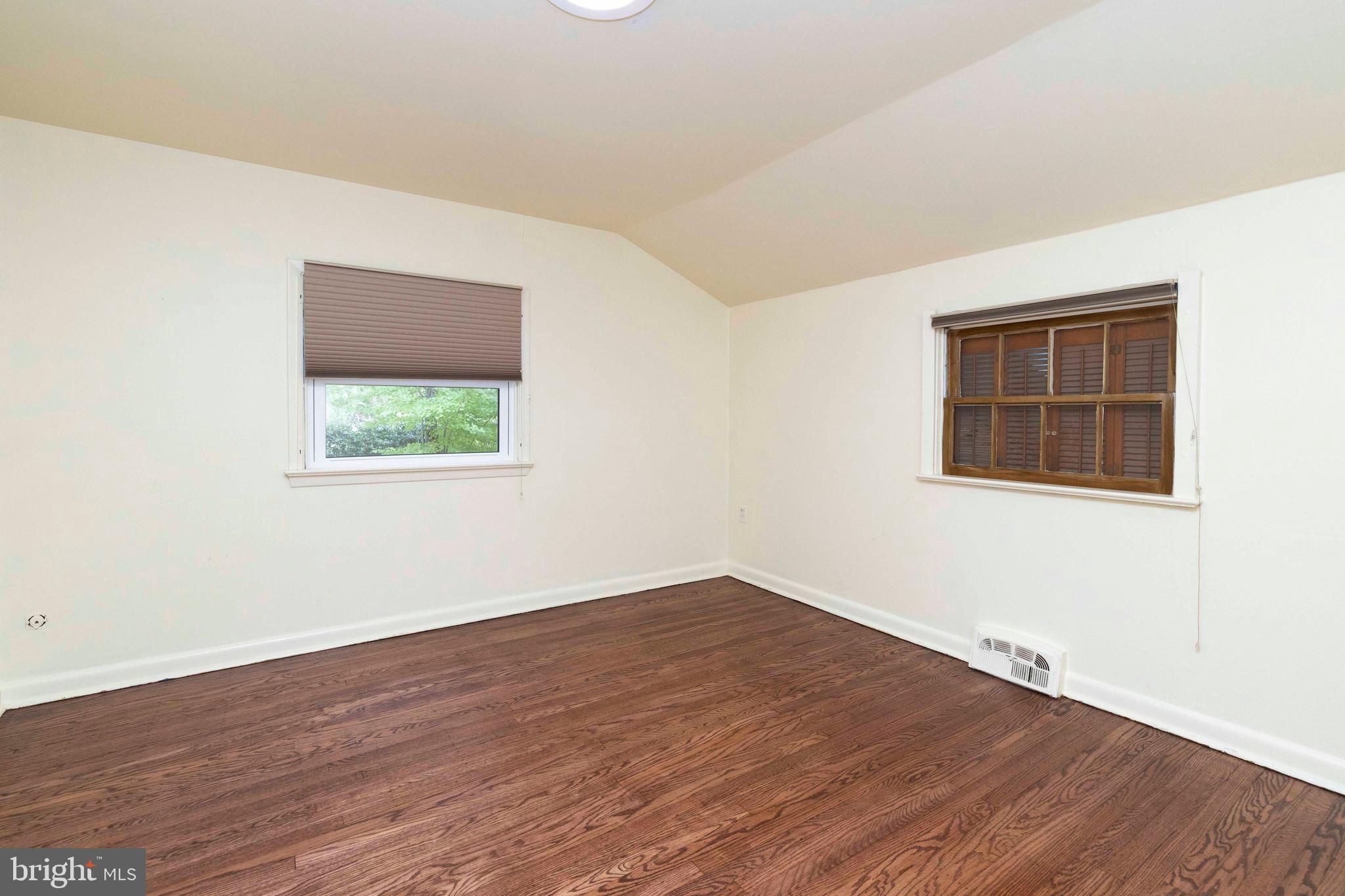 2390 Terwood Road Huntingdon Valley, PA 19006 - Photo 22 of 36 an empty room with wooden floor and windows