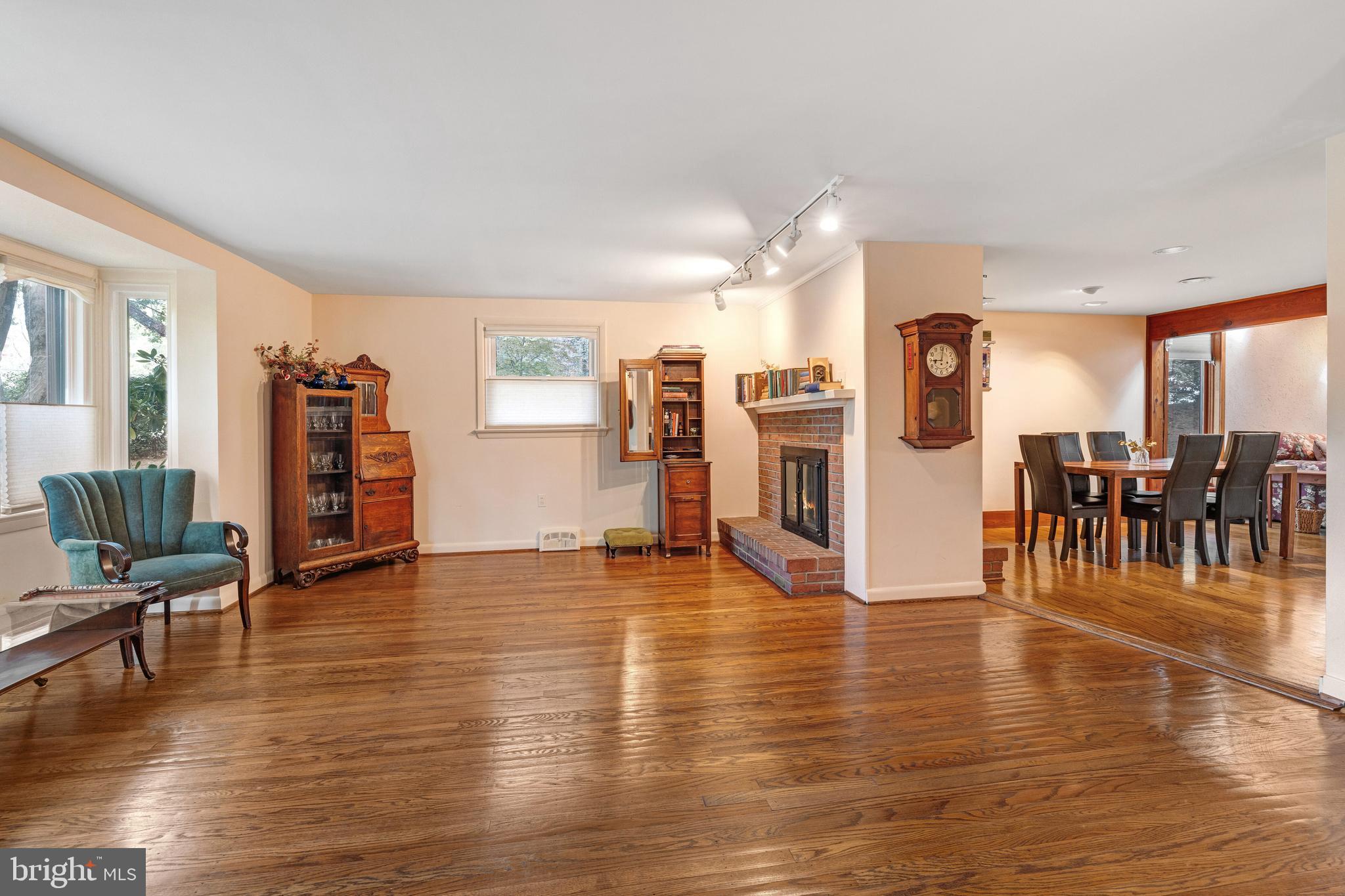 2390 Terwood Road Huntingdon Valley, PA 19006 - Photo 5 of 36 a view of a living room and kitchen with furniture and wooden floor