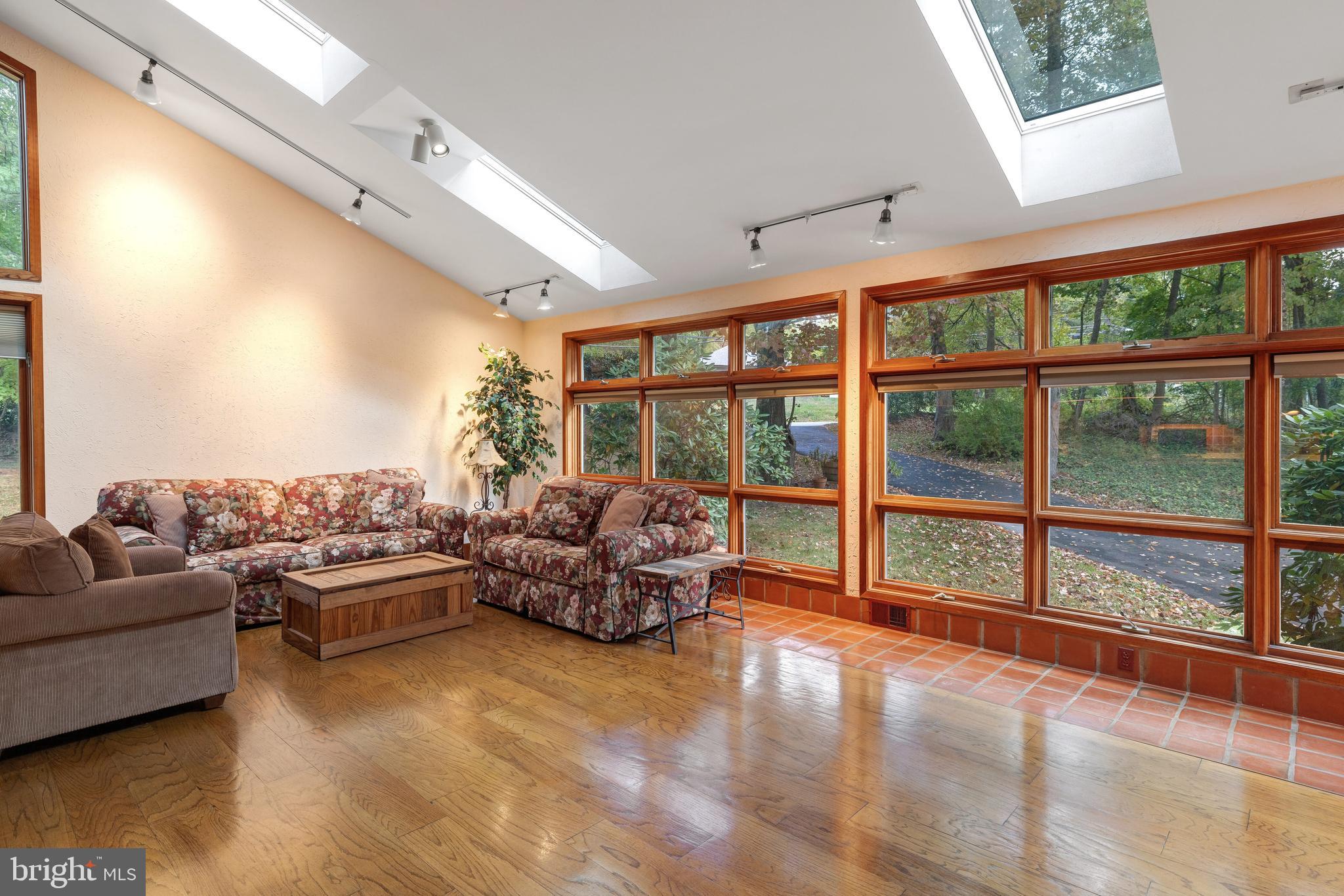 2390 Terwood Road Huntingdon Valley, PA 19006 - Photo 10 of 36 a balcony with furniture and large windows
