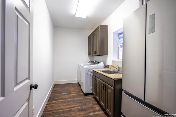 a kitchen with a stove and a refrigerator