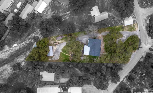 an aerial view of a house with outdoor space and street view