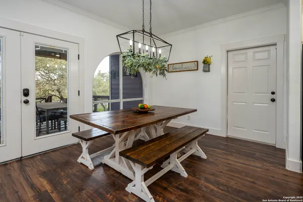 a view of a room with furniture and wooden floor
