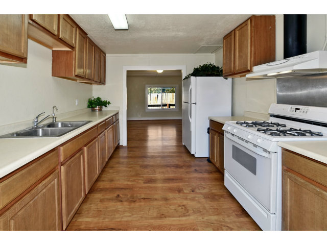 111 Hames Road Corralitos, CA 95076 - Photo 9 of 25 a kitchen with stainless steel appliances granite countertop a stove and a sink