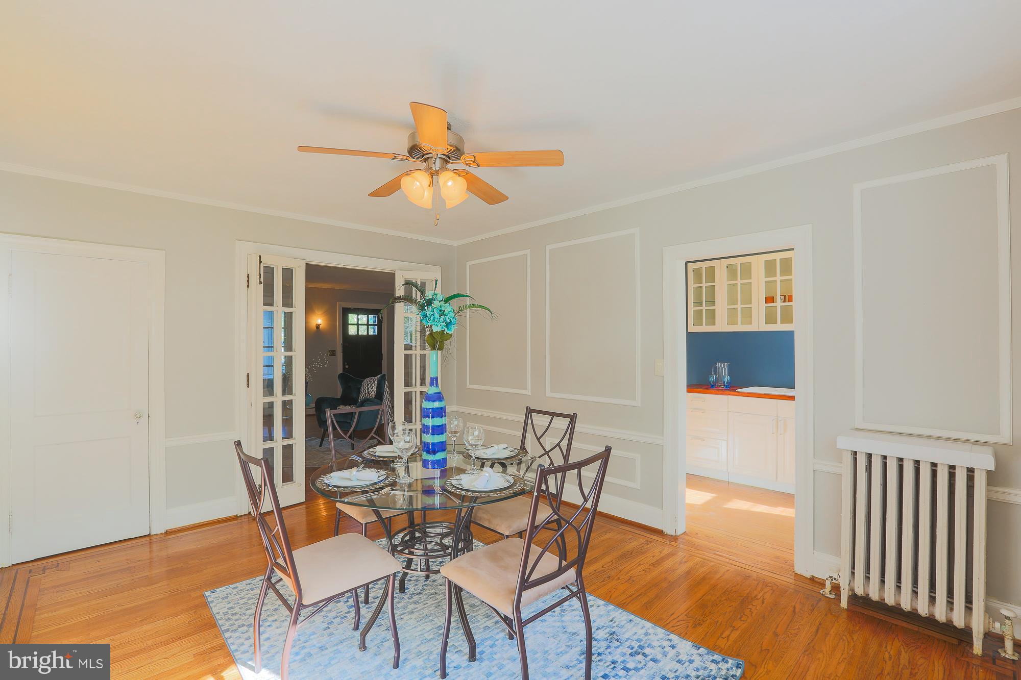 3628 Rexmere Road Baltimore, MD 21218 - Photo 11 of 28 a view of a dining room with furniture and wooden floor