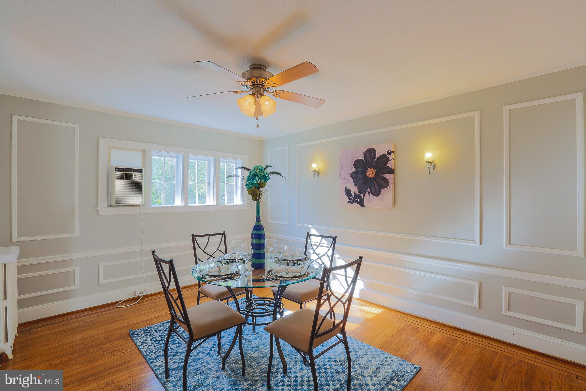 3628 Rexmere Road Baltimore, MD 21218 - Photo 12 of 28 a view of a dining room with furniture and wooden floor