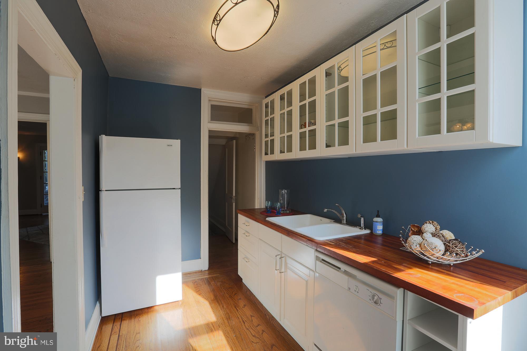 3628 Rexmere Road Baltimore, MD 21218 - Photo 14 of 28 a kitchen with a refrigerator and a sink